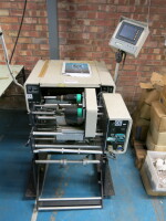 Advanced Poly-Packaging Bagging Machine, Model T-1000 Advanced Poly-Bagger, S/N 210100964 with Inline Thermal Transfer Printer with Operators Manual.