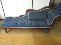 Wooden Chaise Lounge Upholstered in Blue Fabric. Size H80cm x W185cm x D60cm. NOTE: chaise lounge requires attention & upholstery requires cleaning/replacing.