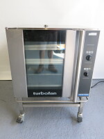 Blue Seal Electric Turbo Fan Oven on Mobile Stand, Model, S/N 479135. Comes with 4 Large Trays & 2 Small Trays. Size H101cm x W74cm x D81cm.