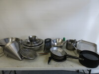 Large Quantity of Kitchen Accessories to Include: 16 x Assorted Sized Stainless Steel Mixing Bowls, 3 x Large Stainless Steel Sieves, 2 x Conical Sieves, 2 x Other Sieves, 5 x Frying Pans, 3 x Stainless Steel Trays, 2 x Assorted Sized Saucepans, 24 x Meta