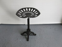 Cast Metal Stool with Tractor Style Seat with Adjustable Height & Foot Rest.
