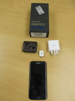 Samsung Galaxy S7 Edge Mobile Phone, Mobile SM-G935F, 32GB. Comes with Original box & Power Supply. NOTE: scratch to screen (As Viewed/pictured).