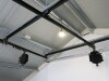Quantity of Assorted Photographic Equipment to Include: 4 x Scissor Light Lifts with Rig, Manfrotto 098B Wall Boom, Tripod in Box, 3 x Rollers with Chain & Brackets and Approx 15 x Assorted Paper Backdrops. - 8