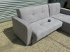 Kair L-Shape Sofabed Upholstered in Grey Fabric with Double Under-Seat Storage. Size H78 x W230 & 170 x D82cm. Boxed/New, RRP £579.00 - 2