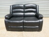 Black Premium Aire Leather 2 Seater Recliner Sofa. Size H100 x W145 x D94cm. Ex Display.