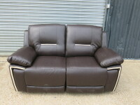 Brown Premium Aire Leather 2 Seater Recliner Sofa. Size H100 x W160 x D84cm. Ex Display. NOTE: only 1 recliner working & brackets to seat base need attention to enable sofa to fix together.