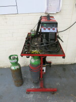 Snap-On Promig 160E Mig/Mag Inverter Welder on Sealey Mobile Workstation Trolley with 2 x Gas Bottles, Welding Mask & Quantity of Accessories (As Viewed).