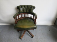 Green Leather Captains Swivel Chair with Button Back Detail. Size H90 x W62 x D65cm.