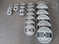 Set of 24 Technogym Urethane Disc Weights in Grey & Black to Include: 6 x 20kg, 7 x 10kg, 4 x 5kg, 3 x 2.5kg & 4 x 1.25kg.