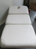 Avalon 3 Section Fully Electric Adjustment Couch with 3 Motors, Handset Control Pad, Face Hole & Upholstered in White Faux Leather. Size Maximum Height 100cm x Length 190cm x Depth 90cm. NOTE: missing face hole plug. - 5