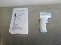 Infrared Thermometer, Model TK-E302. Comes in Original Box with Operating Manual.