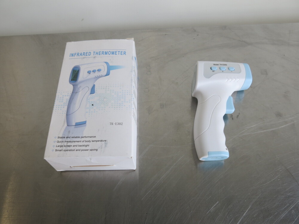 Infrared Thermometer, Model TKE302. Comes in Original Box with
