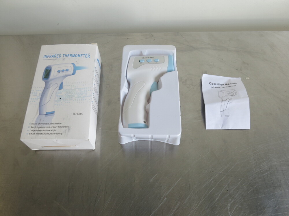 Infrared Thermometer, Model TKE302. Comes in Original Box with