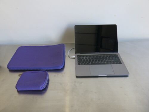 Apple 13" MacBook Pro, Model A1989.Comes with Power Supply & Purple Neoprene Cover.NOTE: requires operating system