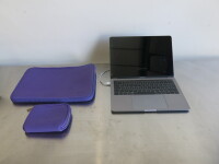 Apple 13" MacBook Pro, Model A1989.Comes with Power Supply & Purple Neoprene Cover.NOTE: requires operating system
