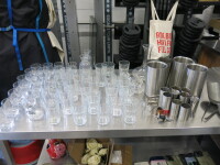 Quantity of Drink Accessories to Include: Assorted Glasses, Vases, Decanter, Wine Coolers, Spirit Measures etc (As Viewed/Pictured).