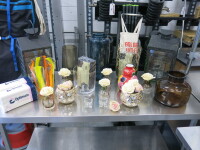 Quantity of Tableware to Include: 9 x Vases, 2 x Lanterns, 5 x Flower Holders, 2 x Candle Holders & 5 x Boxes of Assorted Napkins.
