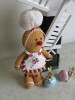 4 x Decorative Items to Include: 1 x Wooden Windmill (Size H56cm), 1 x Gingerbread Man & 2 x Ceramic Rabbits with Eggs. - 4