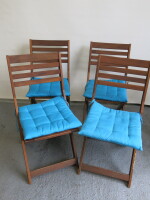 4 x Wooden Folding Chairs with Blue Padded Seat Cushion.