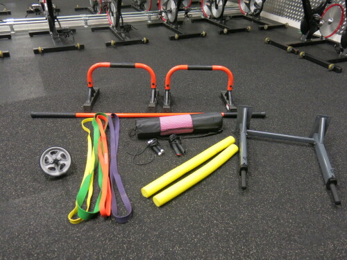 Assortment of Gym Equipment to Include: 2 x Mirafit Press Up Handles, Stick Mobility Movement Stick, Sportstech Wall Mount Dip Bar, Yoga Mat in Bag, 2 x Skipping Ropes, Core Roller & 4 x Resistance Exercise Bands (As Pictured/Viewed).