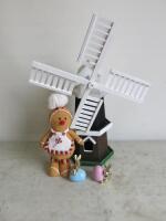 4 x Decorative Items to Include: 1 x Wooden Windmill (Size H56cm), 1 x Gingerbread Man & 2 x Ceramic Rabbits with Eggs.