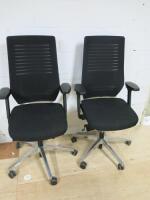 Pair of Remus Seating Office Swivel Chairs Upholstered in Black with a Mesh Back.