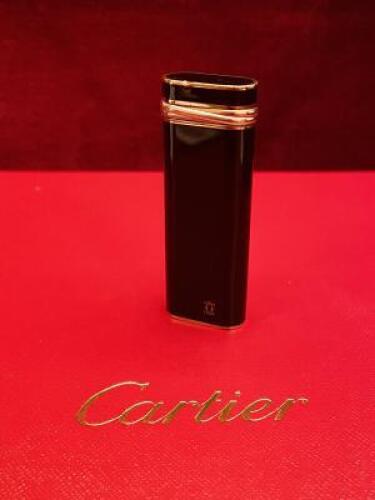 Cartier Lighter in Black Lacquer with Gold Plated Parts.