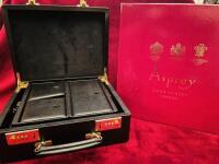 Asprey Black Leather Combination Lock Travel Jewellery Case with Gold Plated Fittings. Features Multi Compartments within Including Additional Locking Case with Key. Appears Unused in Asprey Box (Case Code 445544). Size 10cm x 29cm x 23cm.