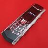 Vertu Signature S Mobile Phone. Stainless Steel with Studded Leather Back with Ceramic Pillow & Keypad, S/N S-0101**, IMEI 355711, Made 02.2010, Lifetimer 0180:24. Comes with Black Leather Signature S Phone Case (Used), 2 Batteries, Partial Sales Pack, Ch - 2