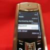 Vertu Signature S Mobile Phone. Stainless Steel with Orange Encrusted Stone Pillow & Black Studded Leather Back. S/N S-0937**, IMEI 355711, Made 12.2013, Lifetimer 0004:14. Comes with Partial Sales Pack, 2 Batteries, Charging Adaptors & Leads. (Note this - 13