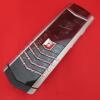 Vertu Signature S Mobile Phone. Stainless Steel with Ceramic Pillow & Back. S/N S-0637**, IMEI - 355711, Made 04.2008 , Lifetimer 0000:01. Comes with 2 Batteries, UK Charging Adaptor, Lead & Car Charge USB Adaptor.