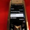 Vertu Signature S Mobile Phone. Stainless Steel with Emerald Stone Encrusted Pillow, Black Studded Leather Back. S/N P-0044**, IMEI 004401, PROTO, Made 09.2008, Lifetimer 0160:59. Comes with 2 Batteries, UK Charging Adaptor & Lead. - 11