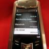 Vertu Signature S Mobile Phone. Stainless Steel with Tutti Frutti Diamonds, Sapphires & Emerald Encrusted Pillow with Black Leather Studded Back. S/N S-01211**, IMEI 355711, DEMO, Made 09.2010 , Lifetimer 0000:00, with Russian Keypad. Comes with 2 Batteri - 12