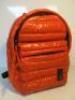 Mueslii New Zealand, Mini Daily Puffer Orange Coloured Rucksack.