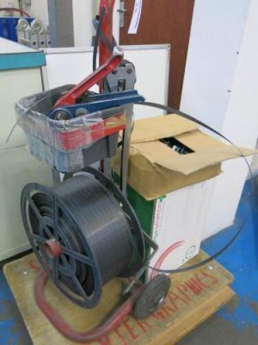 Pallet Strap Banding Machine on Trolley with 2 Rolls of Band & 2 Boxes of Clips.