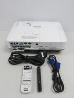 Epson LCD Projector Model EB-2255U, s/n X6539100036. Comes with Remote Control, Wireless Presenter & Black Plastic Hard Shell Carry Case.