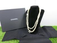 String of Chanel Pearls with 2 x Chanel Interlocking "C" with Clear Square Stones in Presentation Case. Approx. 110cm Total Length, 55cm Linked.