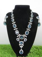 Ciner Ladies Dress Necklace and Earing Set, with Clear Stones and Larger Blue Stones in Pouch.