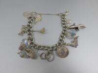 Silver Hallmarked Charm Bracelet with 13 Charms.