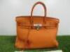 Clemence Orange Leather Birkin 35. Comes with Padlock, Key & Dust Cover.Note: We have had an expert look to Authenticate this bag, they have declared it to be a "Replica" with the following remarks.Reasons for Verdict:-Moulding of Edges Around BagStitchin - 2