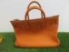 Clemence Orange Leather Birkin 35. Comes with Padlock, Key & Dust Cover.Note: We have had an expert look to Authenticate this bag, they have declared it to be a "Replica" with the following remarks.Reasons for Verdict:-Moulding of Edges Around BagStitchin - 5