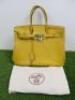 Taurillion Mustard Leather Birkin 35. Comes with Padlock, Key & Dust Cover.Hermes Taurillion Mustard Leather Birkin 35.Note: We have had an expert look to Authenticate this bag, they have declared it to be a "Replica" with the following remarks.Reasons fo