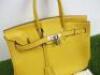 Taurillion Mustard Leather Birkin 35. Comes with Padlock, Key & Dust Cover.Hermes Taurillion Mustard Leather Birkin 35.Note: We have had an expert look to Authenticate this bag, they have declared it to be a "Replica" with the following remarks.Reasons fo - 4