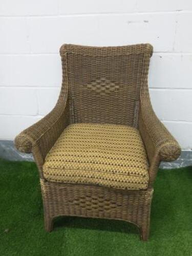 Dark Rattan Armchair with Cushion. NOTE: cat damage to side