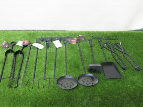 13 x Black Metal Fire Tools to Include: Wall Bracket, 2 x Eye Tongs, 1 x Eye Poker, 3 x Eye Toast Fork, 2 x Eye Roasters, 1 x Brush, 1 x Shovel & 2 x Tongs.