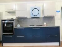 Ex-Display Kitchen Painted MDF Slab wood Doors in Dark Blue & Gloss White Laminate Cupboards (Multiwood) to Consist of Worktops, Base Units, Wall Units & Handles to Include: Approx. 2.14M & 0.70M Run of 30mm Grey Quartz Worktops with Space for Gas Hob Se