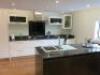 Ex-Display Kitchen & Island Gloss White MDF Doors (Multiwood) to Consist of Worktops, Upstands, Sink, Glass Splashback, Base Units, Wall Units, Cupboards & Handles to Include: Approx. 3.2m & 2.6m Run of 30mm Titanium Gold Granite Worktop & Upstand, 90cm G