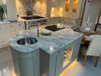 Large Ex-Display Kitchen with Island Painted in Ash In Frame Shaker in Cream & Pale Green to Consist of Worktops, Sinks, Base Units, Wall Units & Cupboards, Plinths with Cup & Knob Handles to Include: Approx. 4.6M Run of 30mm Andomeda White Granite Workto