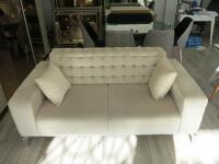 2 Seat, 2 Cushion Cream Velour Sofa with Studded Back and Fold up Back. Size 80 x 190 x 100cm.