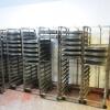 38 x Mobile 14 Rack Oven Trolleys (for use with Lot 1). Comes with Approx 480 Aluminium Baking Trays (As Viewed)